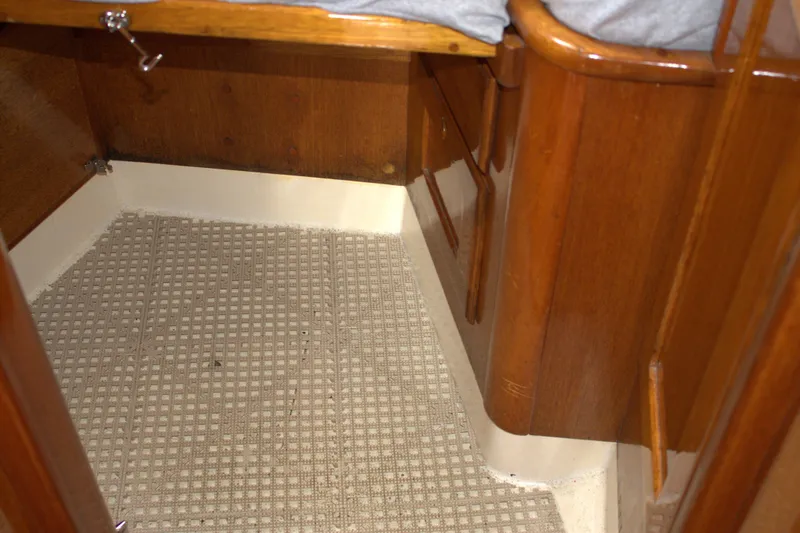 Slide: The Image of Interior cabin of 1980 Bristol 35.5 sailboat with wooden finish and carpeted floor. - 47