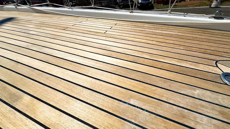 Slide: The Image of Teak deck of a 2014 Hanse 445 sailboat in sunlight. - 13
