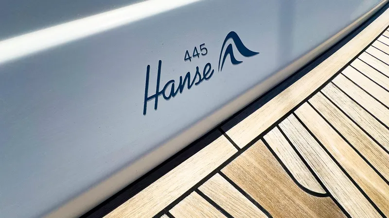 Slide: The Image of Hanse 445 sailboat 2014 model, close-up of logo and deck - 14