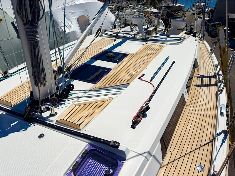 Slide: The Image of 2014 Hanse 445 sailboat deck with teak wood and rigging. - 15