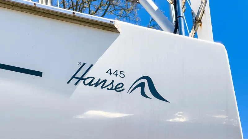 Slide: The Image of 2014 Hanse 445 sailboat logo on white hull. - 16