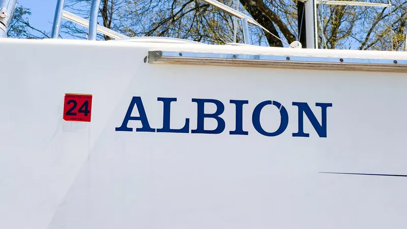 Slide: The Image of Side view of 2014 Hanse 445 sailboat named Albion with number 24. - 21