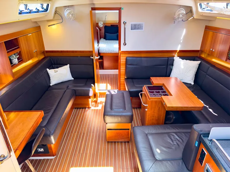 Slide: The Image of Interior of 2014 Hanse 445 sailboat with modern seating and wooden finishes. - 22