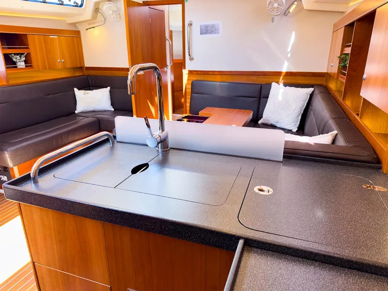Slide: The Image of Modern interior of 2014 Hanse 445 yacht with sleek kitchen and cozy seating area. - 25