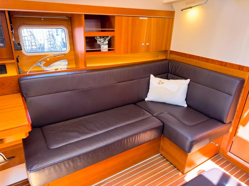 Slide: The Image of Interior of 2014 Hanse 445 yacht with leather seating and wooden cabinetry. - 29
