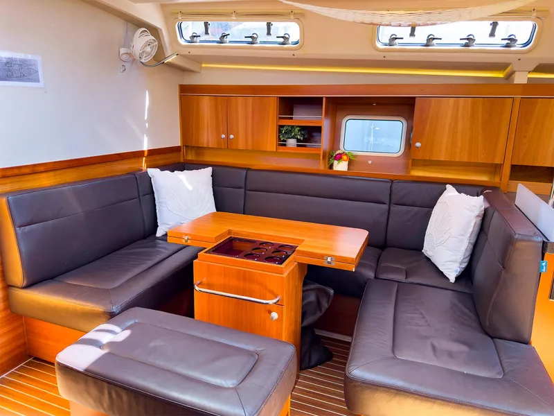 Slide: The Image of Spacious interior of 2014 Hanse 445 yacht with comfortable seating and wooden cabinetry. - 31