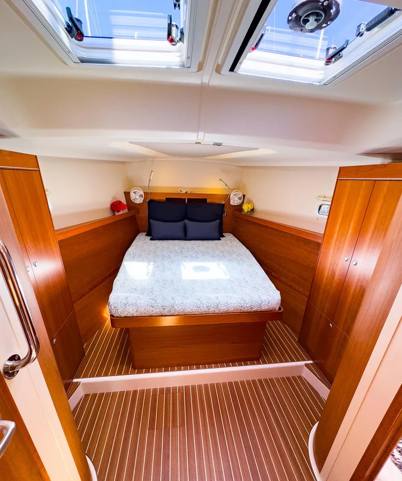 Slide: The Image of Interior cabin of 2014 Hanse 445 yacht with double bed and skylights. - 35