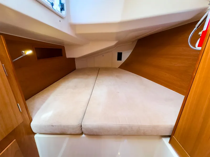 Slide: The Image of Hanse 445 2014 yacht interior cabin with double bed and wooden finish. - 38