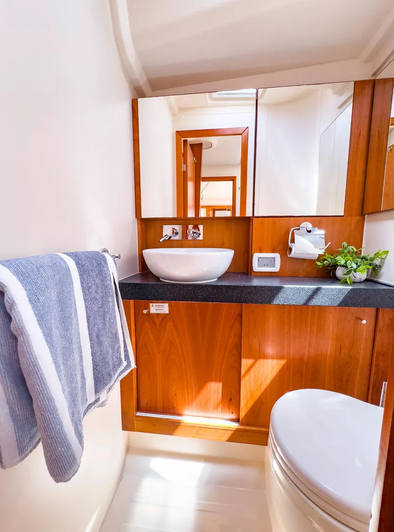 Slide: The Image of Modern bathroom in 2014 Hanse 445 yacht with wooden cabinetry and sleek fixtures. - 39