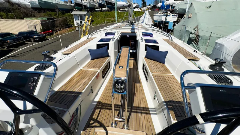 Slide: The Image of 2014 Hanse 445 sailboat with spacious deck and seating area. - 4