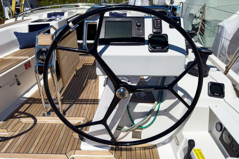Slide: The Image of Hanse 445 2014 yacht cockpit with steering wheel and navigation equipment. - 5