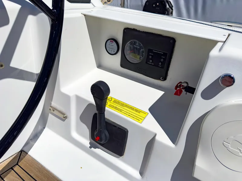 Slide: The Image of Control panel of a 2014 Hanse 445 sailboat with throttle and gauges. - 6