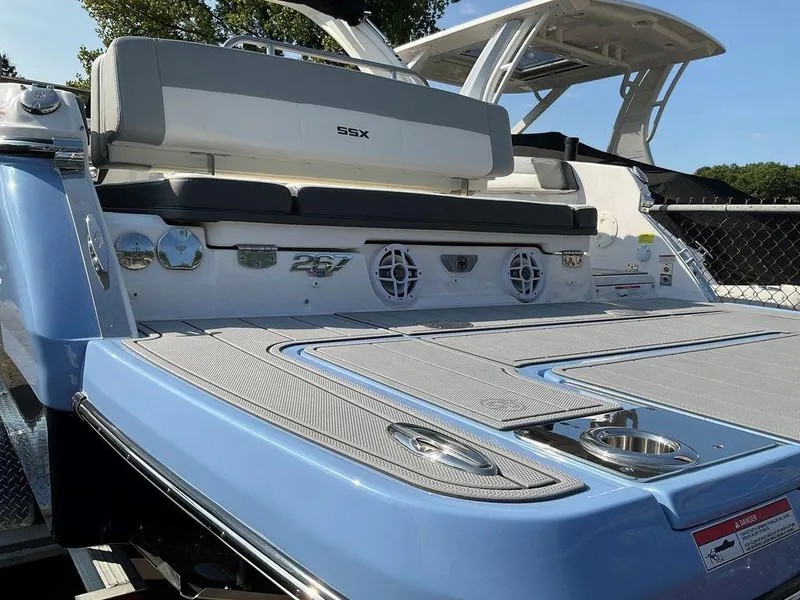Slide: The Image of 2024 Chaparral 267 SSX boat, rear view, showcasing sleek design and modern features. - 12