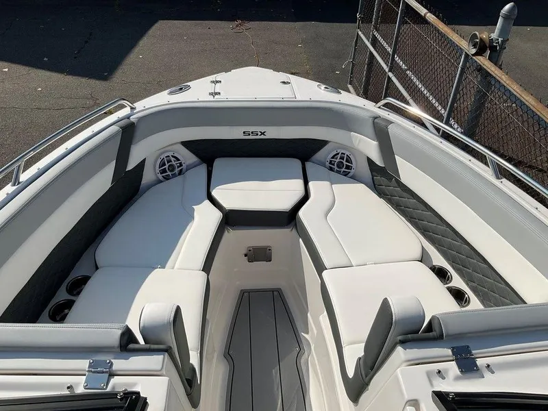 Slide: The Image of 2024 Chaparral 267 SSX boat interior with white seating and modern design. - 18