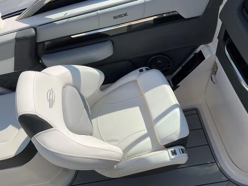 Slide: The Image of 2024 Chaparral 267 SSX boat interior with luxurious white seating. - 24