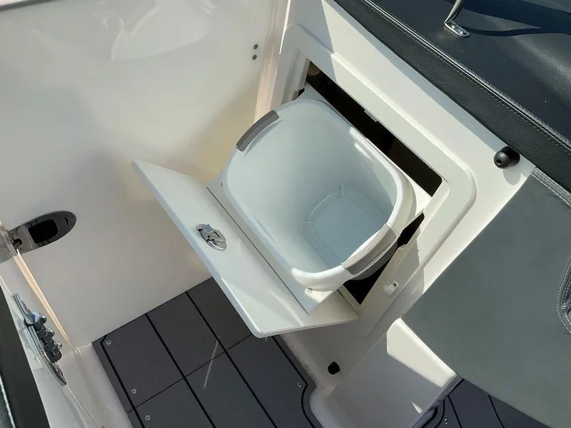 Slide: The Image of 2024 Chaparral 267 SSX boat with built-in storage compartment. - 27