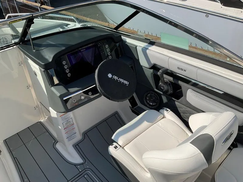 Slide: The Image of 2024 Chaparral 267 SSX boat cockpit with modern steering and controls. - 34