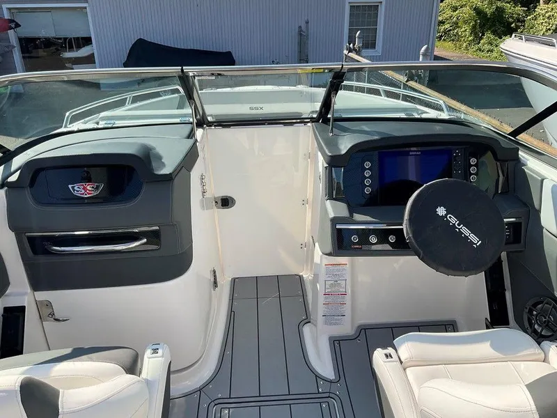 Slide: The Image of 2024 Chaparral 267 SSX boat cockpit with modern dashboard and steering wheel. - 37