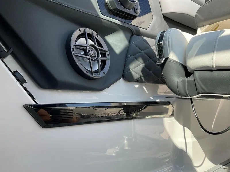 Slide: The Image of 2024 Chaparral 267 SSX interior with speaker and luxurious seating. - 39