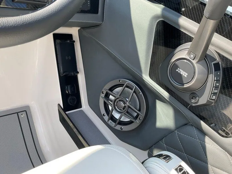 Slide: The Image of 2024 Chaparral 267 SSX boat interior with speaker and steering wheel detail. - 41