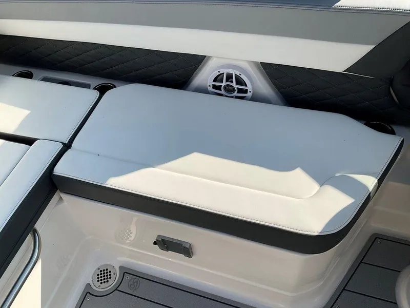 Slide: The Image of 2024 Chaparral 267 SSX boat interior seating with speaker detail. - 45