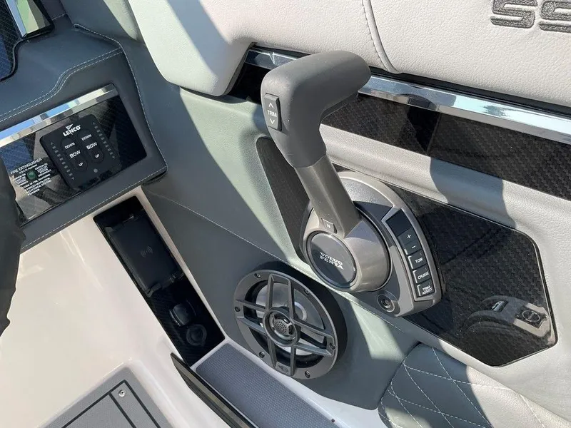 Slide: The Image of 2024 Chaparral 267 SSX boat control panel with joystick and speaker. - 46