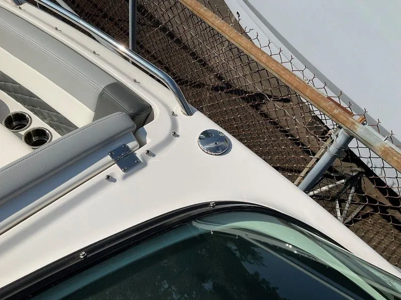 Slide: The Image of 2024 Chaparral 267 SSX boat detail with sleek design and stainless steel accents. - 48