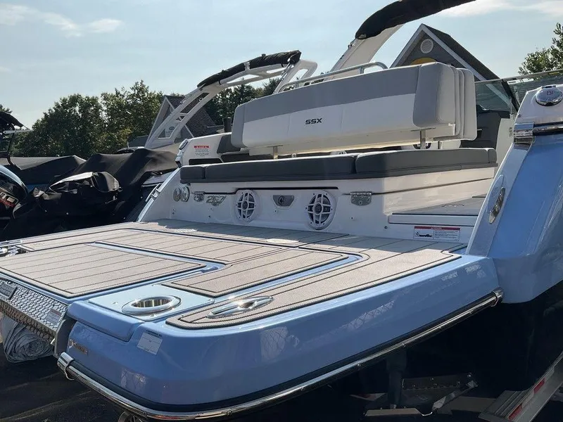 Slide: The Image of 2024 Chaparral 267 SSX boat with spacious deck and modern design. - 7