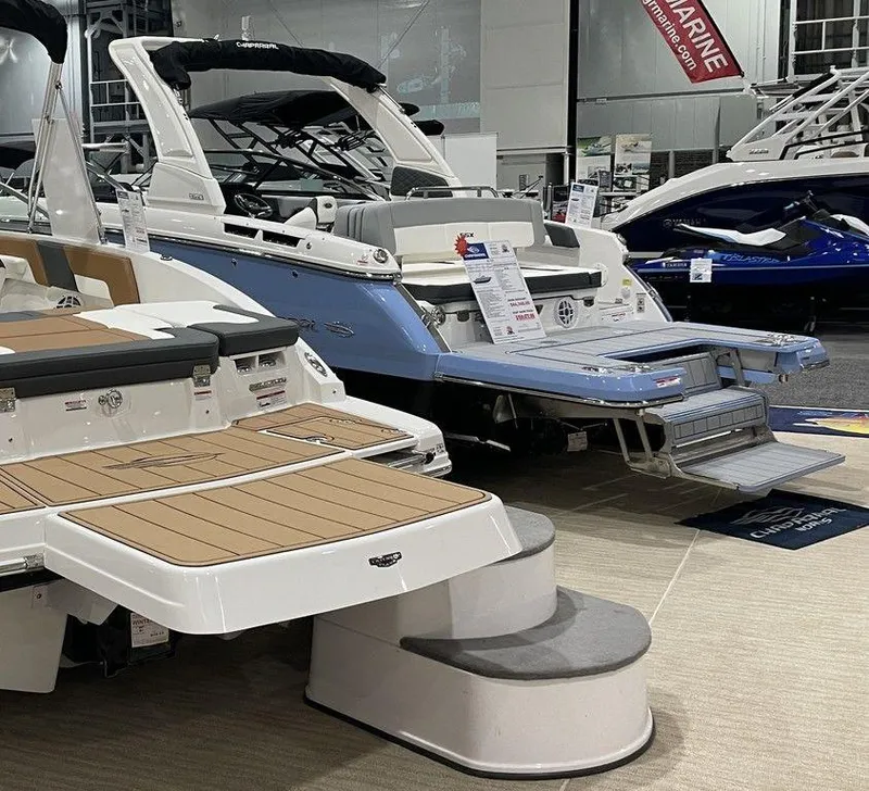 Slide: The Image of 2024 Chaparral 267 SSX boats displayed at a marine exhibition. - 8