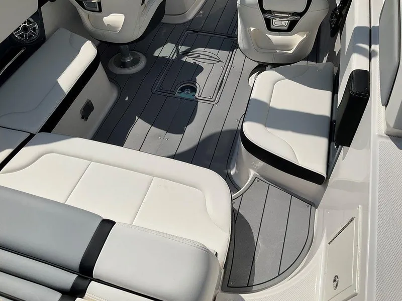 Slide: The Image of 2024 Chaparral 270 OSX boat interior with sleek seating and modern design. - 23