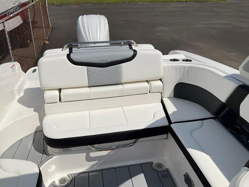 Slide: The Image of 2024 Chaparral 270 OSX boat interior with white seating and modern design. - 27