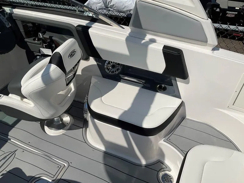 Slide: The Image of 2024 Chaparral 270 OSX boat interior with white seating and modern design. - 29
