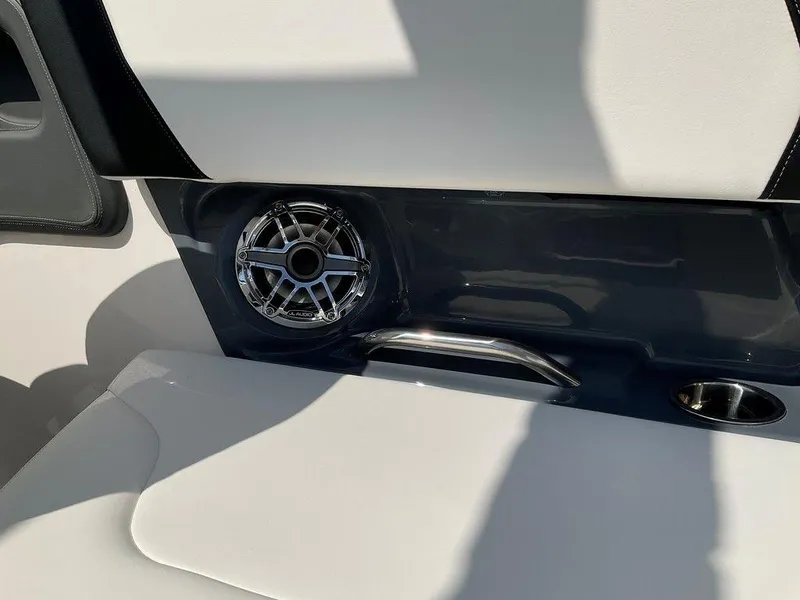 Slide: The Image of 2024 Chaparral 270 OSX boat interior with speaker and cup holder. - 30