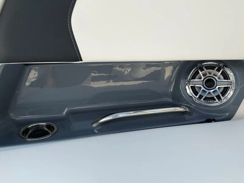 Slide: The Image of 2024 Chaparral 270 OSX interior detail with speaker and handle. - 31