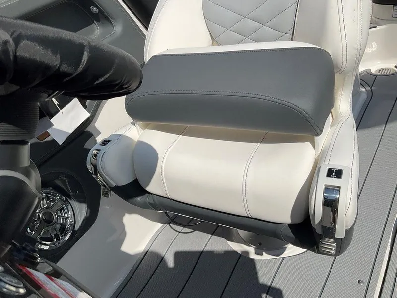 Slide: The Image of 2024 Chaparral 270 OSX boat seat with steering wheel and controls. - 32