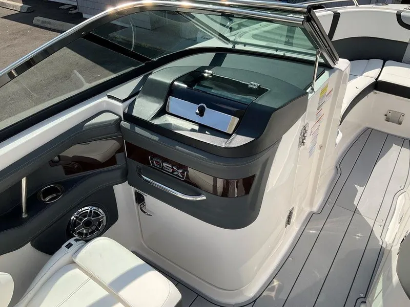 Slide: The Image of 2024 Chaparral 270 OSX boat interior with sleek design and modern amenities. - 33