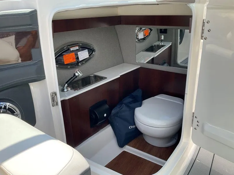 Slide: The Image of 2024 Chaparral 270 OSX boat interior with sink and toilet. - 35