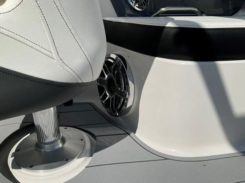 Slide: The Image of 2024 Chaparral 270 OSX interior detail with speaker and seating. - 5