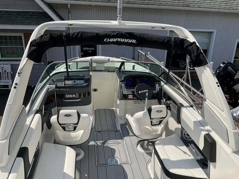 Slide: The Image of 2024 Chaparral 270 OSX boat interior with modern seating and dashboard. - 8