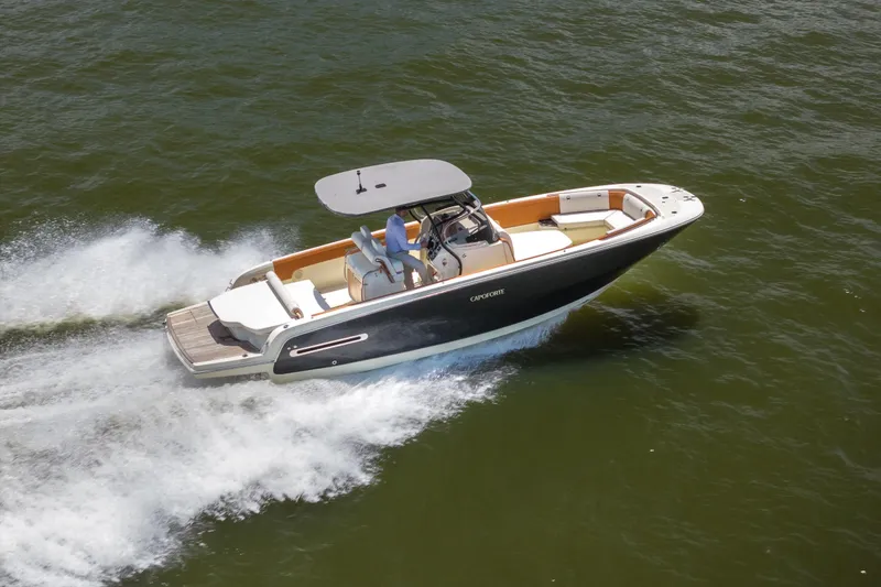 The Image of 2024 Capoforte SX280I boat cruising on open water, showcasing sleek design and performance. - 1