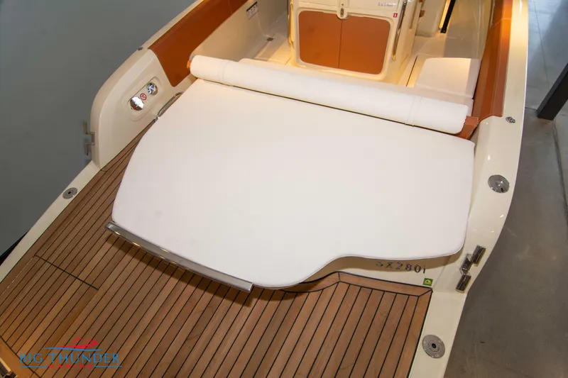 Slide: The Image of Capoforte SX280I 2024 boat with teak deck and cushioned seating area. - 10