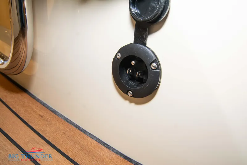 Slide: The Image of 2024 Capoforte SX280I boat power outlet on wooden deck. - 12