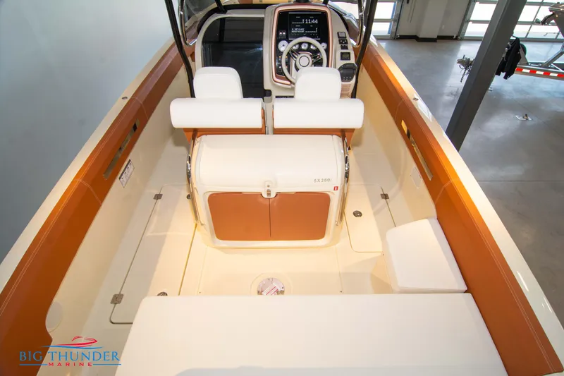Slide: The Image of 2024 Capoforte SX280I boat interior with helm and seating area. - 15