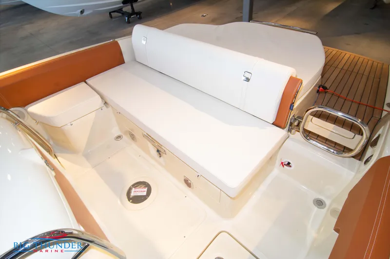 Slide: The Image of 2024 Capoforte SX280I boat interior with white and orange seating, spacious deck area. - 17