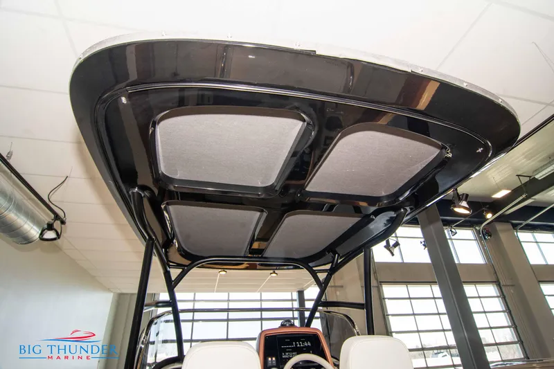Slide: The Image of 2024 Capoforte SX280I boat interior with overhead view of the helm and T-top. - 23