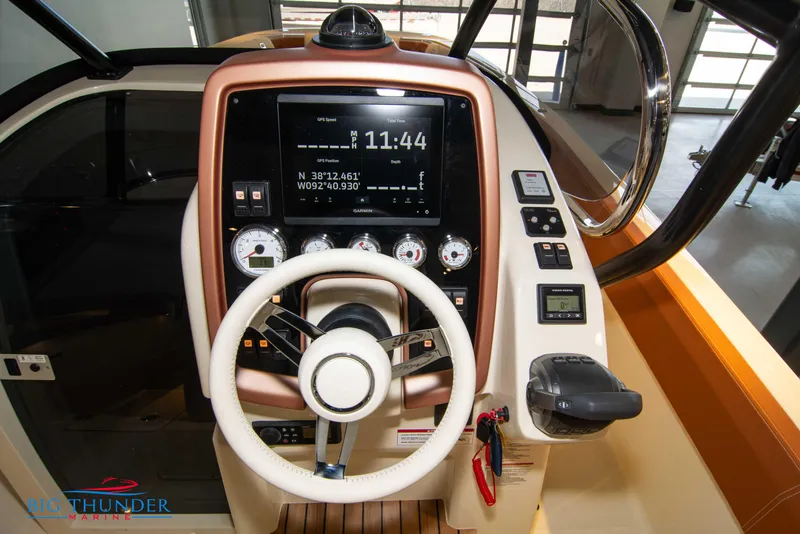 Slide: The Image of 2024 Capoforte SX280I boat dashboard with steering wheel and navigation controls. - 25