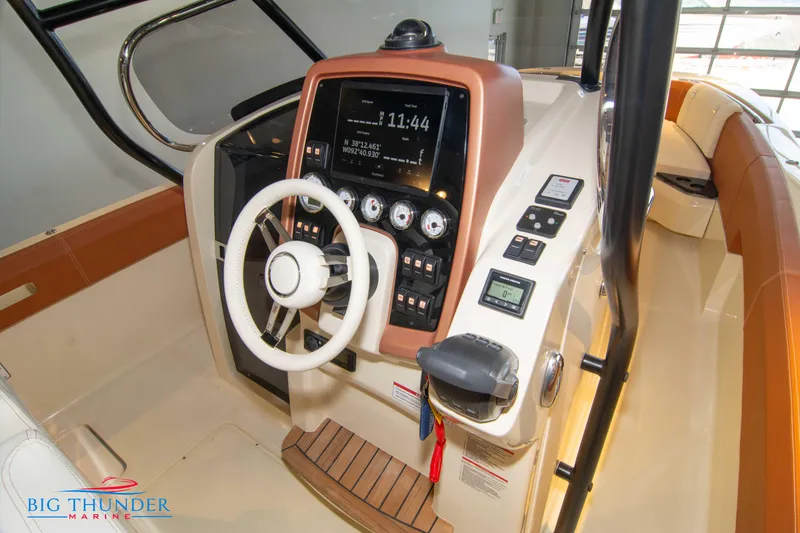 Slide: The Image of 2024 Capoforte SX280I boat helm with modern controls and steering wheel. - 26