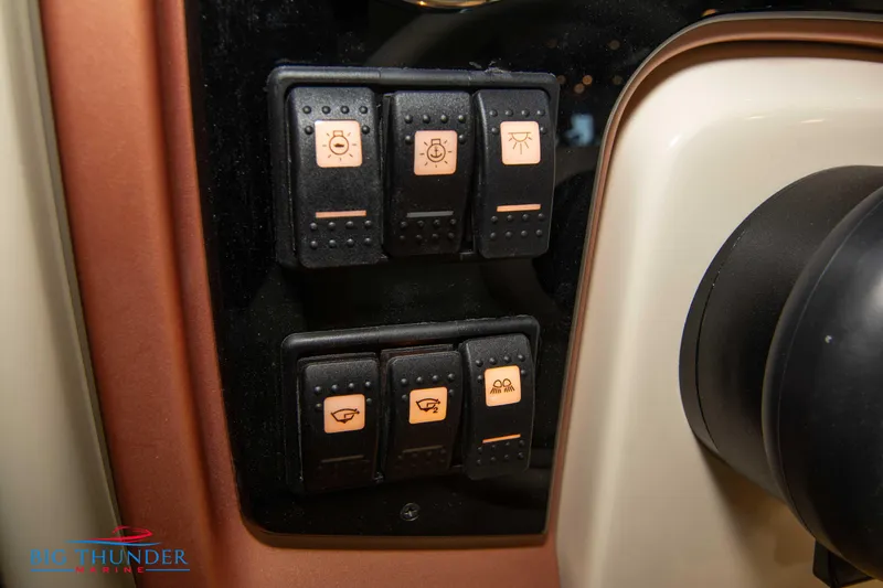 Slide: The Image of Control panel of 2024 Capoforte SX280I boat with various switches. - 33