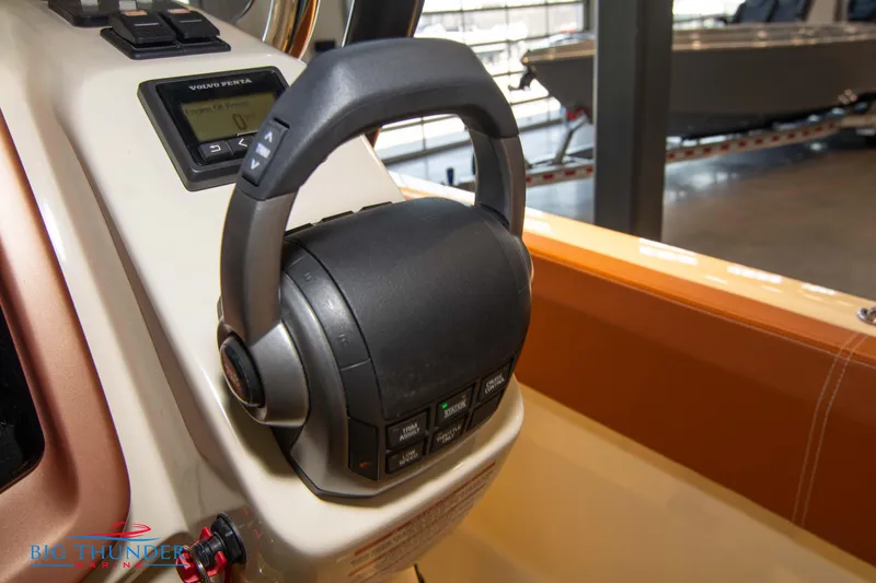 Slide: The Image of Close-up of the 2024 Capoforte SX280I boat throttle control. - 38