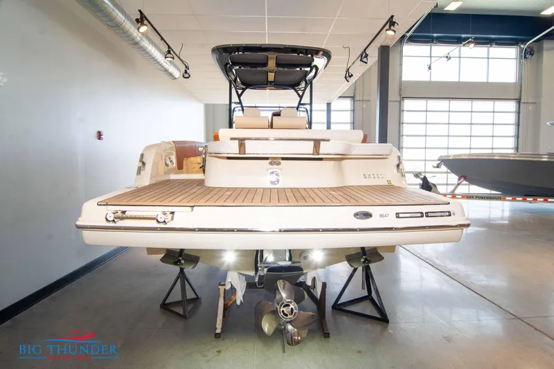 Slide: The Image of 2024 Capoforte SX280I boat displayed indoors, rear view. - 4